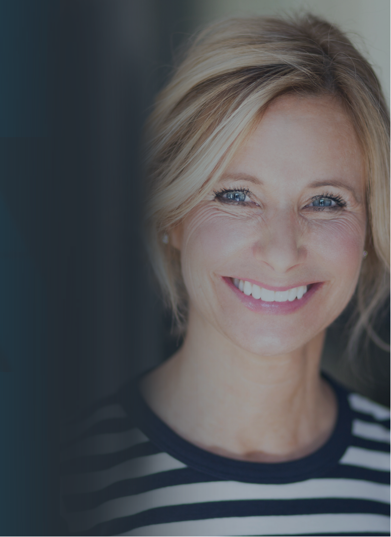 Smiling mid-aged woman representing HRT, Coaching, Bioidentical Creams & Weight Loss Peptides.